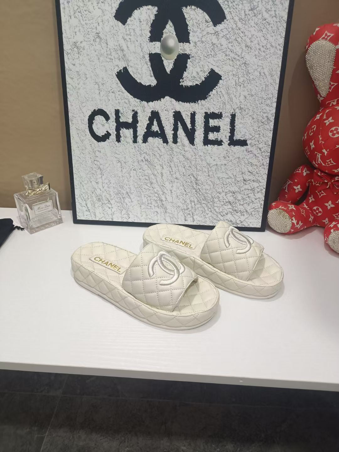 Chanel 26s Quilted Slide Sandals In White Calfskin